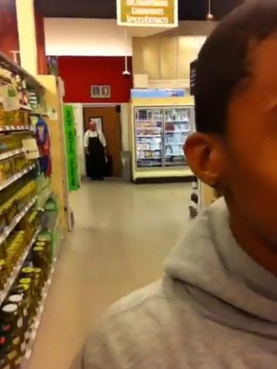 Racist guy following black customers.