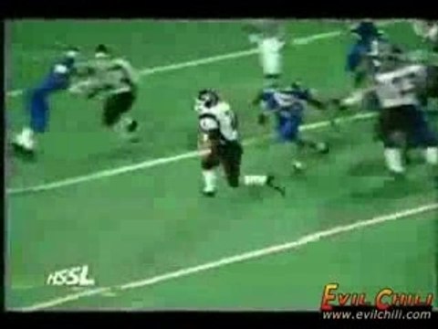 Football Player Hurdles Defender