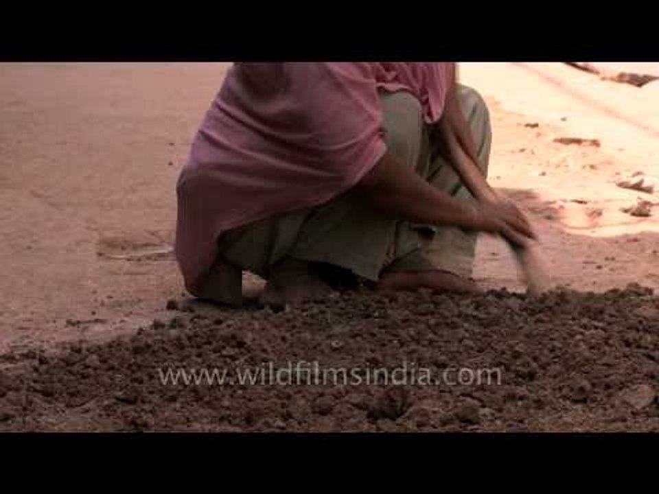 Woman breaking the mud