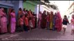 Women singing folk songs and performing traditional Holi dance