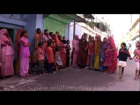 Women singing folk songs and performing traditional Holi dance