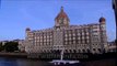 Mumbai's Taj Mahal hotel and coastal fishing boats