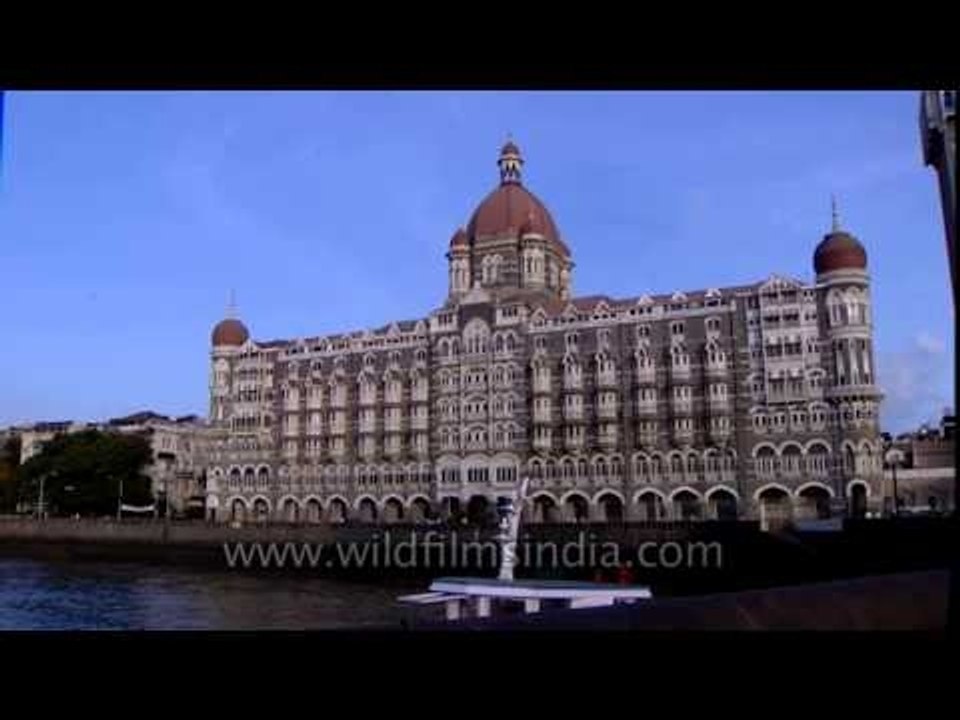Mumbai's Taj Mahal hotel and coastal fishing boats