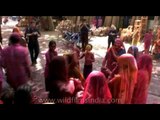 Women dance around the streets of Rajasthan during Holi celebration