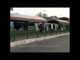 Poor and homeless people dry their clothes on the railings of  pedestrian subways - Delhi