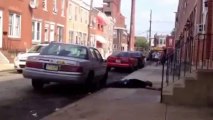 Weird Guy Attacks Car, Knocks Himself Out!