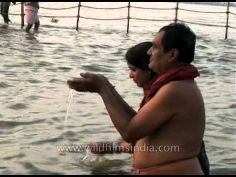 Devotees performing rituals of Holy dip during Ardh Kumbh Mela
