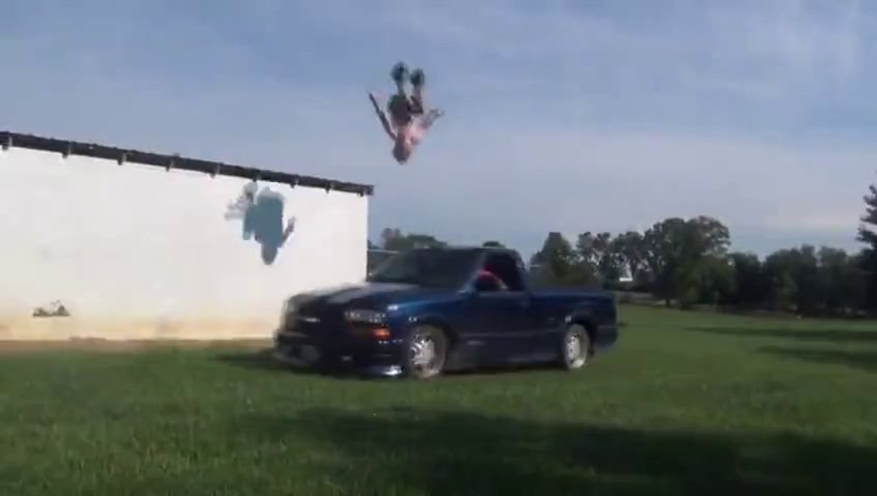 Awesome stunt : Backflip from a roof on a moving car! Really???
