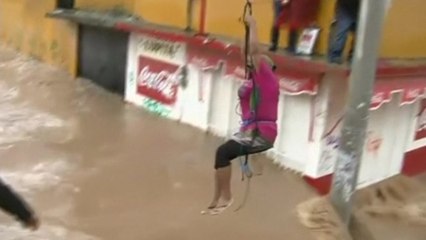 Locals forced to swim through Mexico's flooded streets