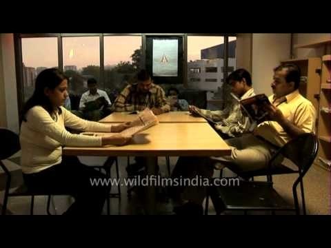 Outsourcing to India: BPO employees take a break between calls