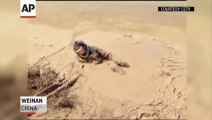 Woman Rescued From Mud in China!