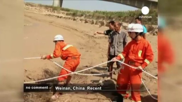 Chinese woman rescued from mud - no comment
