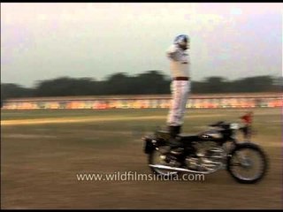 The BSF personnel rode the bikes down the ground standing, sitting opposite, reading newspaper
