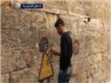 رسام يحاول إعادة الحياة إلى أحياء حلب