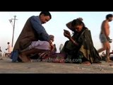 Devotees getting ready after the holy bath in Sangam, Allahabad - Ardh Kumbh Mela, 2007