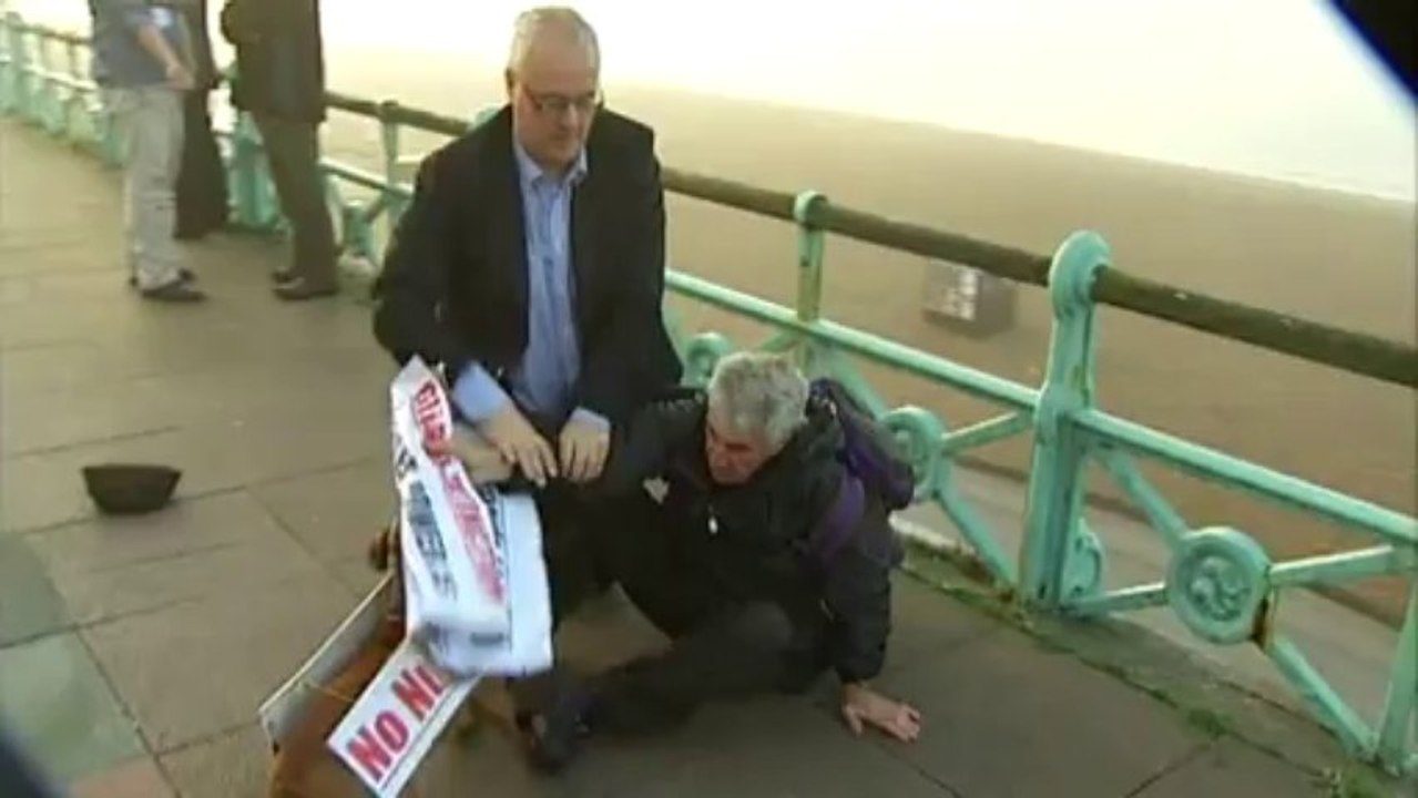 Protester tackled to ground during live television interview