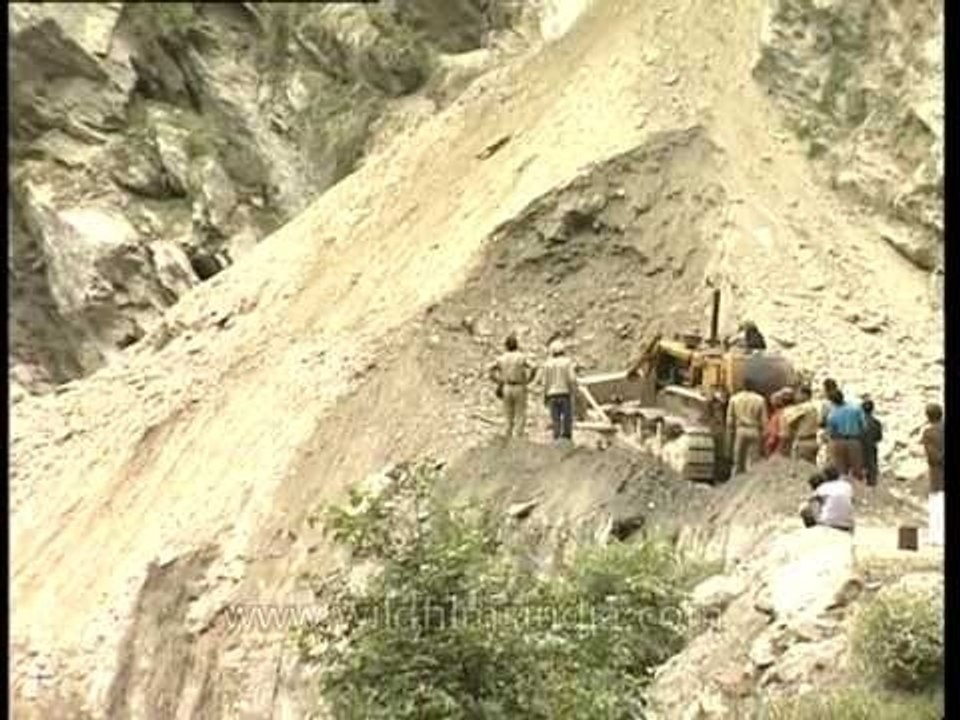 Bull-dozers hard at work to clear the road to G...