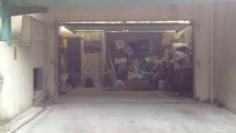 Porte de garage sectionnelle plafond Sécura motorisée et posée par APG Accès Portes de Garage