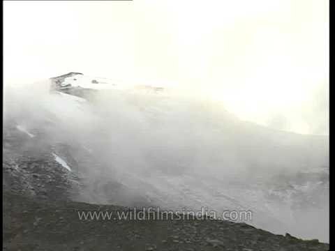 Mist and clouds shroud the Jogin peaks as seen from Rudragaira