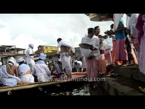 Priest performing aarti rituals before Heigru-Hidongba