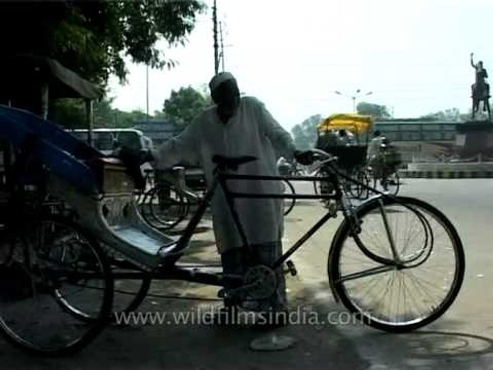 Old man repairing a cycle