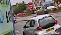 Woman is knocked down by motorcycle and then robbed