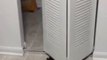 Dumb cat gets stuck and meows behind cabinet open door!!