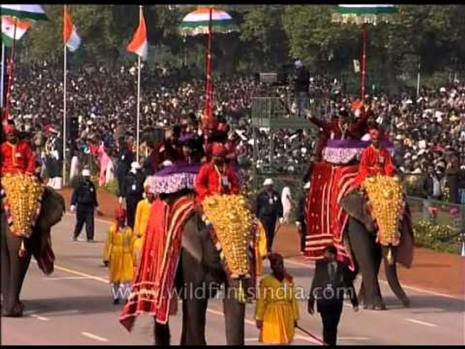 Students siting on top of elephants participate on Republic Day