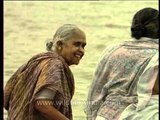 A pair of old women taking holy dips on the banks of river Ganga