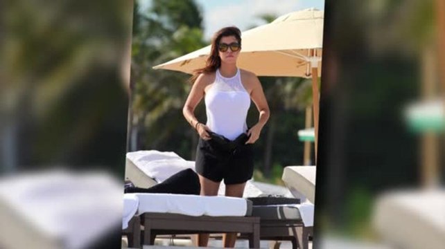 Kourtney Kardashian Looks White Hot in a Sheer Panelled Swimsuit