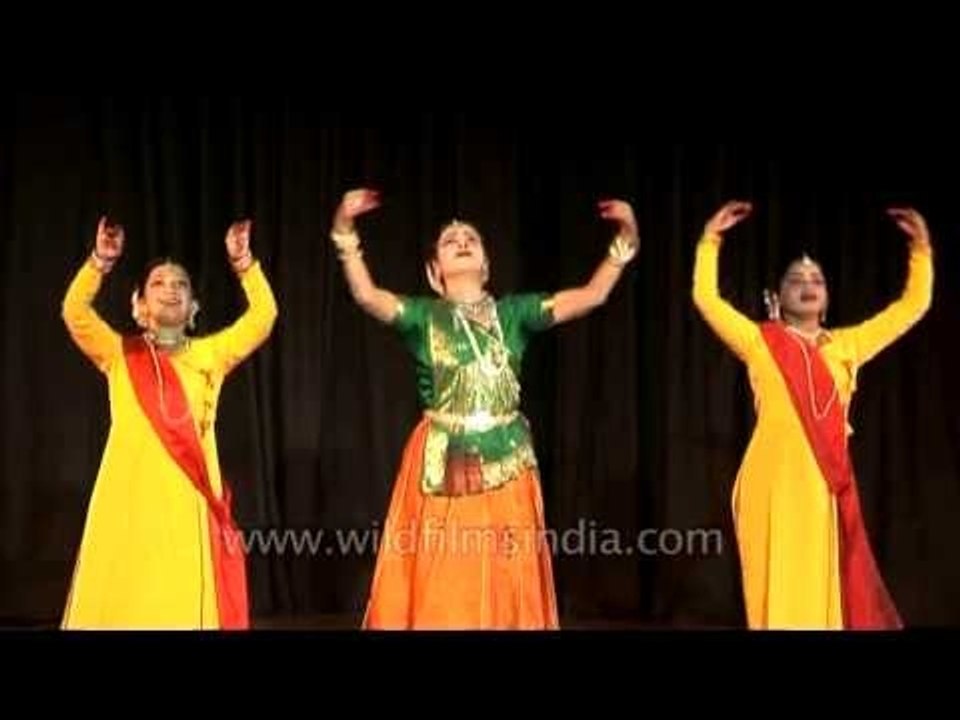 Trio of Kathak dancers performing on stage