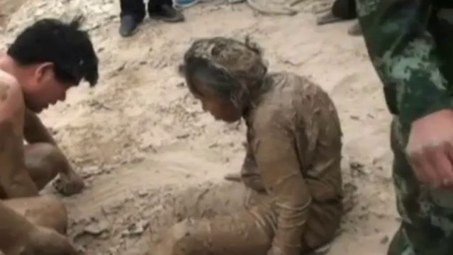 Sinking woman rescued from deep mud