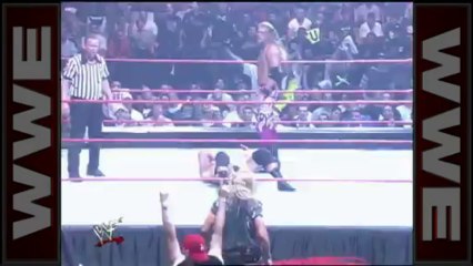 Christian emerges from the crowd to distract Edge