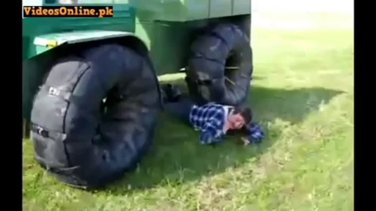 Crazy Man Lets Tractor Run Him Over