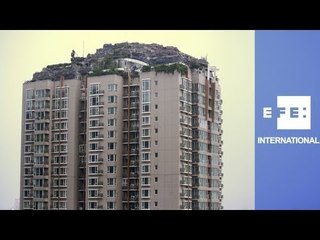 Controversial mountain atop Beijing skyscraper ordered to be removed