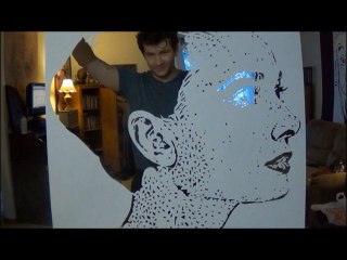 A cut out of paper portrait of Audrey Hepburn