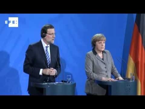 Germany's Merkel supports Spanish P.M. Rajoy in wake of scandal