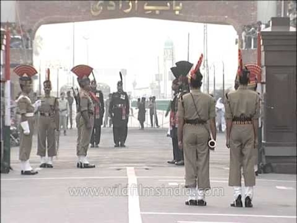 Indian soldier and Pakistan soldier marching side by side at Wagah Border