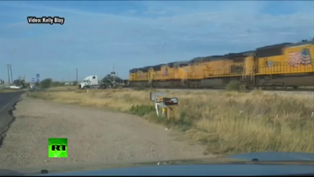 ‘Holy Smokes!’ Train collides with truck stuck on tracks