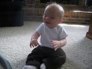 Baby can't stop laughing at vacuum!