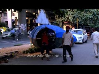 Effigy of Ravana carried by workers on street : at Delhi