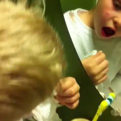 Landen trying to pull his tooth out