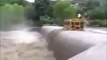 School bus crosses flooded bridge after massive rains!!