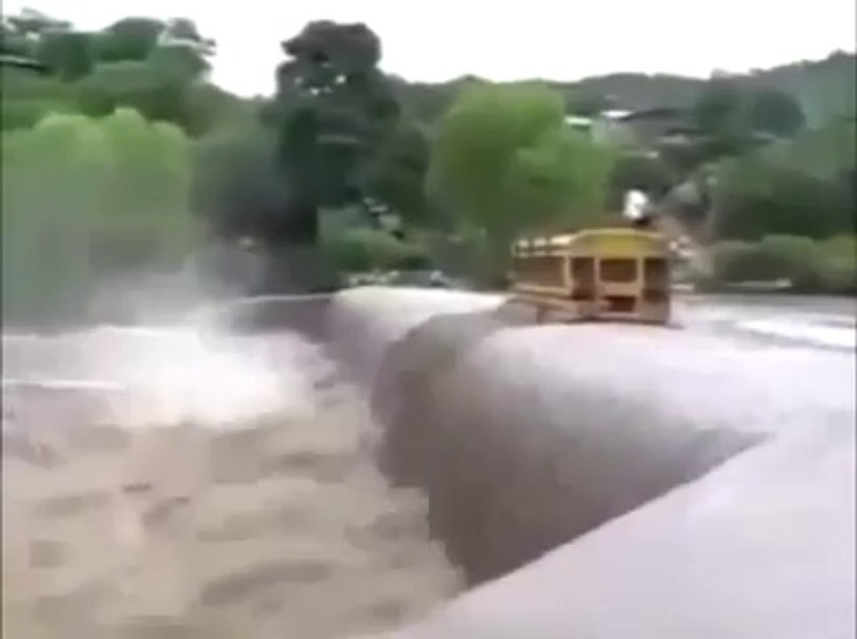 School bus crosses flooded bridge after massive rains!!