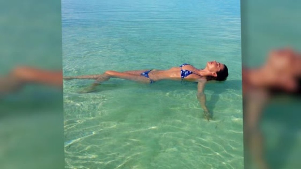 Miranda Kerr Shows Off Her Bikini Body on a Family Beach Break