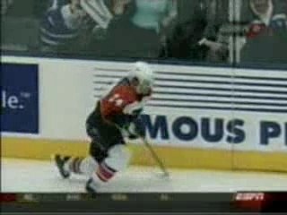 hockey - Darcy Tucker hits  Sami Kapanen