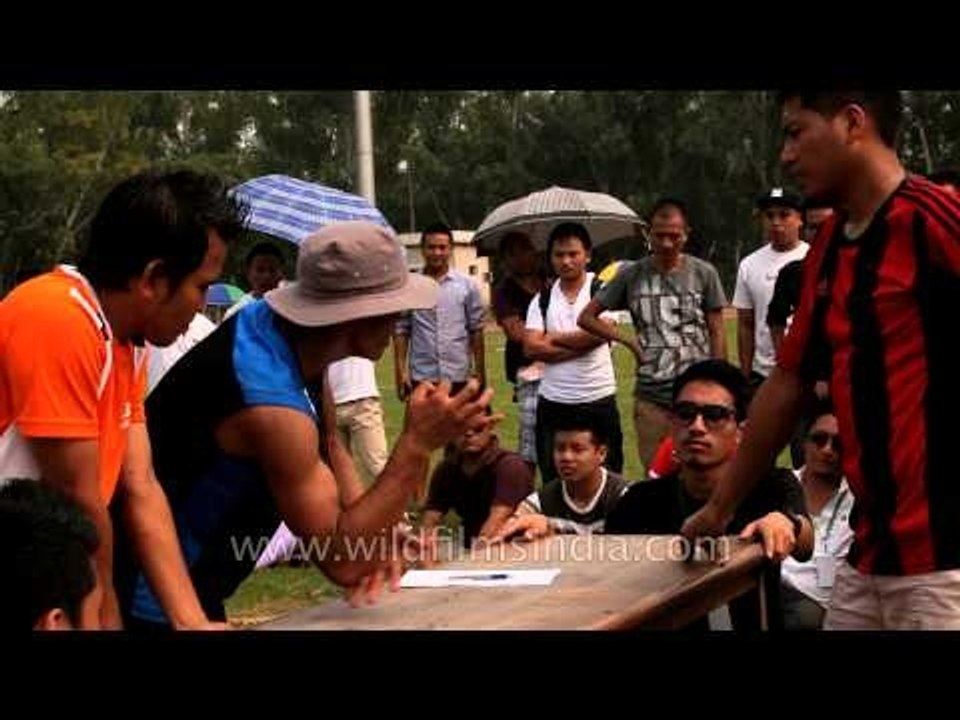 Referee teaching arm wrestling rules: At the 50th Naga Fest'13