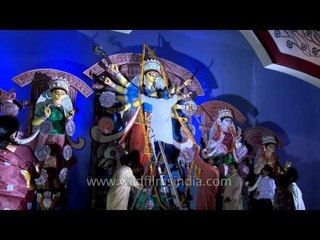 Devotees offer the garland to Maa Durga on Maha Shashthi day