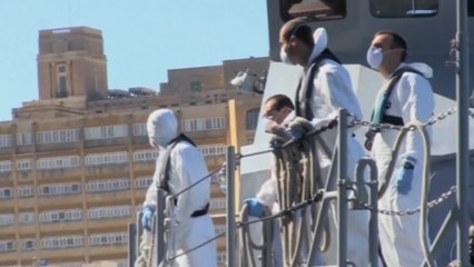 Migrants rescued by a U.S. Navy ship arrive in Malta