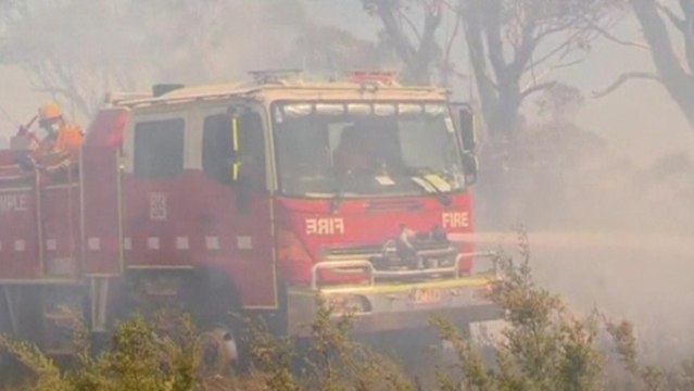 Australian firefighters race to contain wildfires